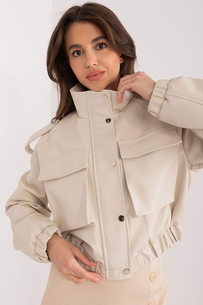 Chic and elegant women's transitional jacket from NM, crafted from durable eco-leather, ideal for casual or sophisticated outfits, embellished with epaulettes.