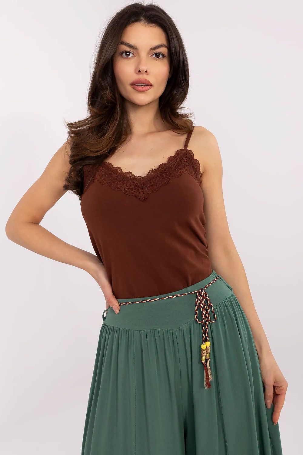 Close-up of Sublevel's feminine cotton top, highlighting the luxurious lace detail on the V-neck for an exquisite everyday style.