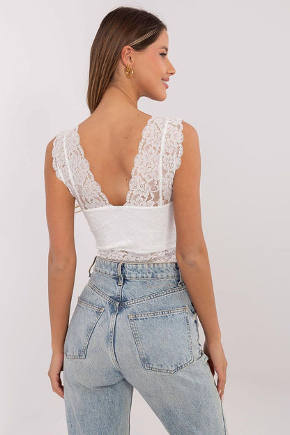 A chic summer outfit featuring the Sublevel sleeveless openwork top paired with jeans and a stylish skirt, ideal for both casual and elegant occasions.
