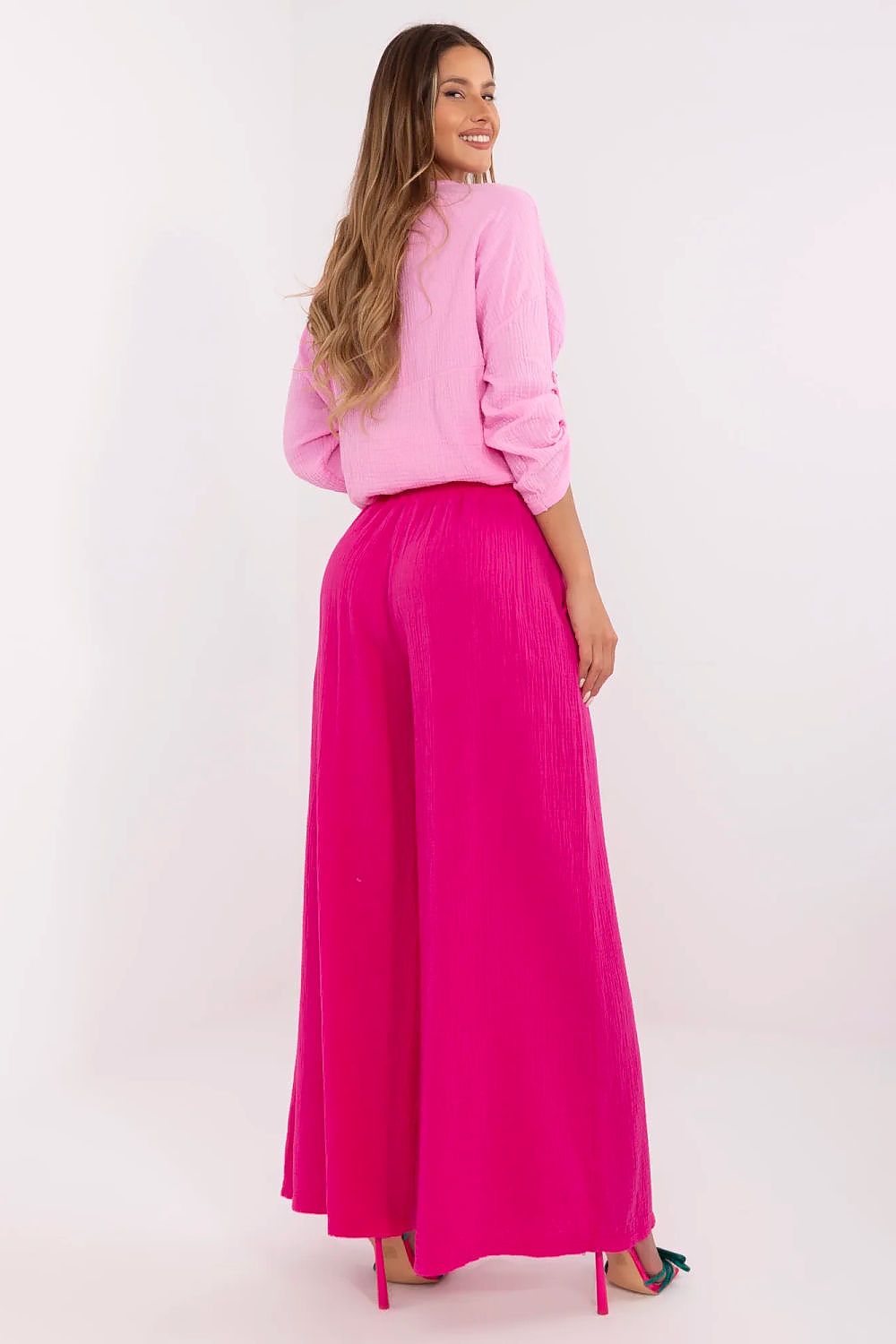 Chic women's palazzo trousers by Italy Moda, crafted from cotton with side slip pockets, perfect for versatile, fashionable outfits.