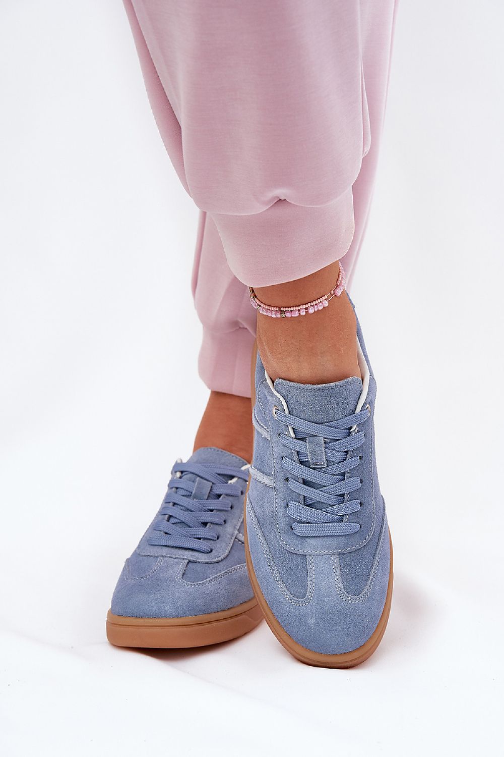 Chic and versatile women's suede sneakers by Step in style with rounded toes, classic lacing, and comfort footbed, offered in EU sizes 36-41.