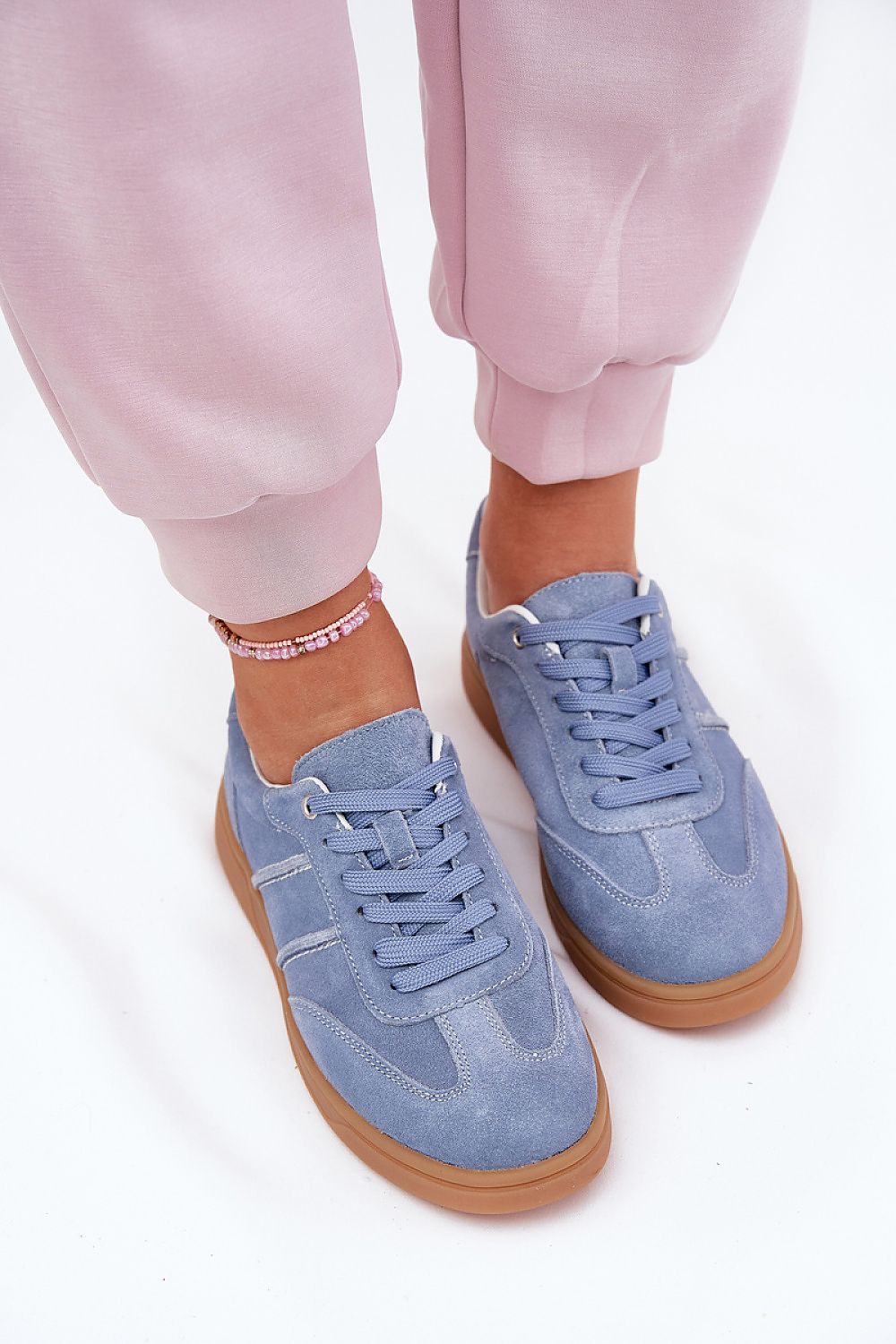 Luxury women's suede sneakers by Step in Style, featuring classic lacing and a comfortable footbed, ideal for all-day wear.