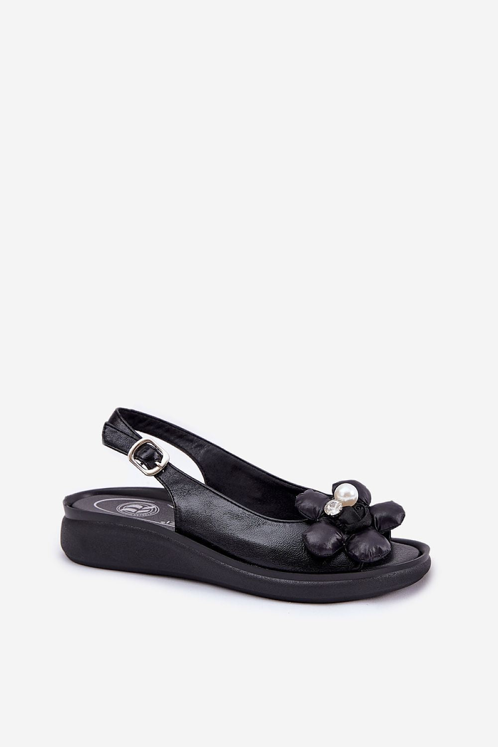 Close-up view of Step in Style eco-leather women's sandals with decorative flower accents and adjustable buckle strap, designed for comfort and stability.