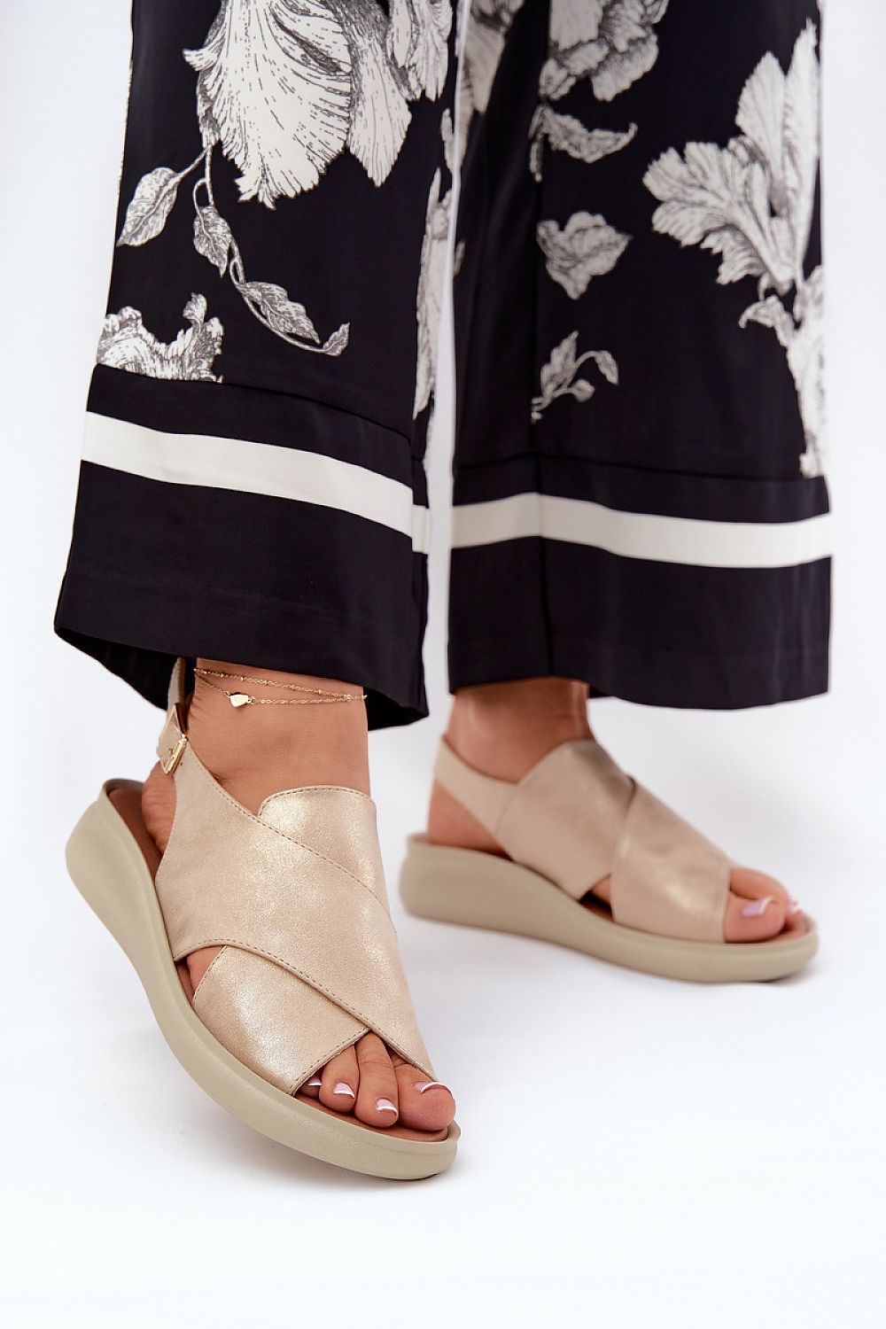 Jezzi Women's eco leather sandals with adjustable buckle strap, highlighting luxurious craftsmanship and premium materials.