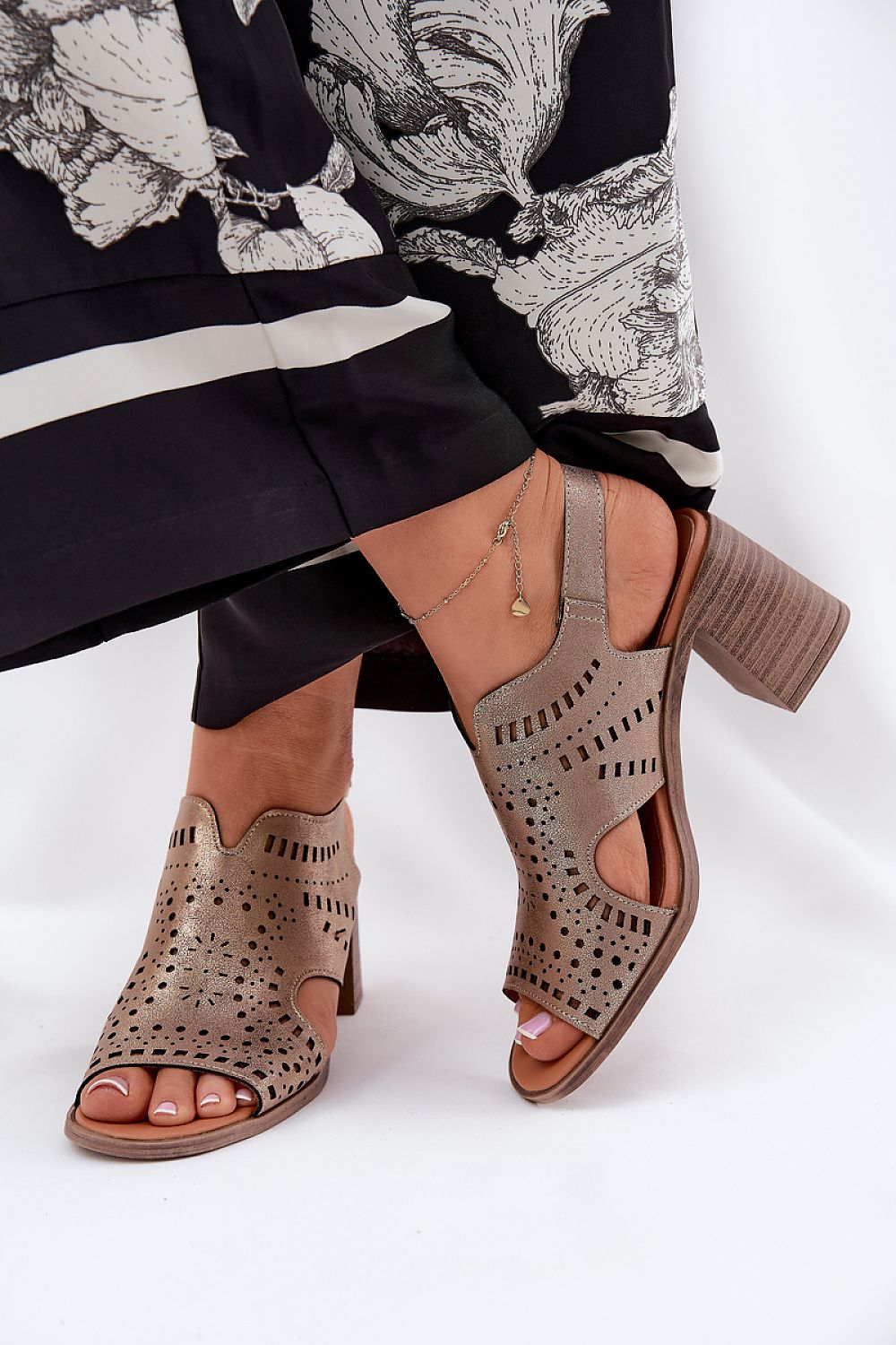 Stylish Jezzi Women's Eco Leather Heel Sandals featuring an adjustable strap and perforated upper, perfect for summer outfits.