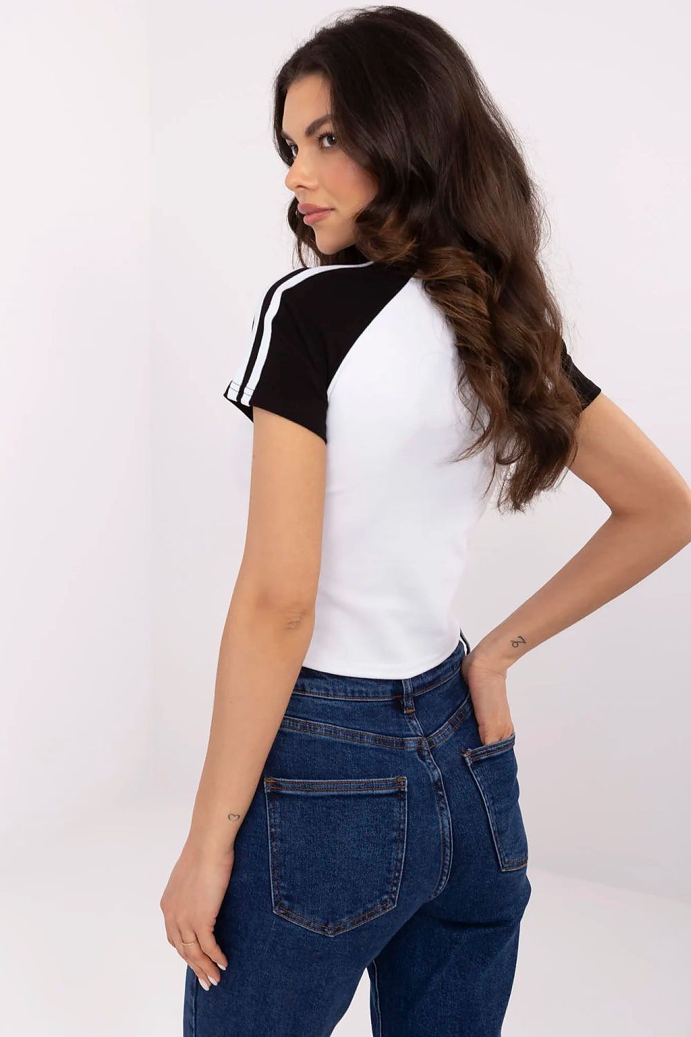 Close-up view of the NM luxury women's T-shirt showcasing detailed embroidery and sequins, perfect for adding elegance to everyday outfits.