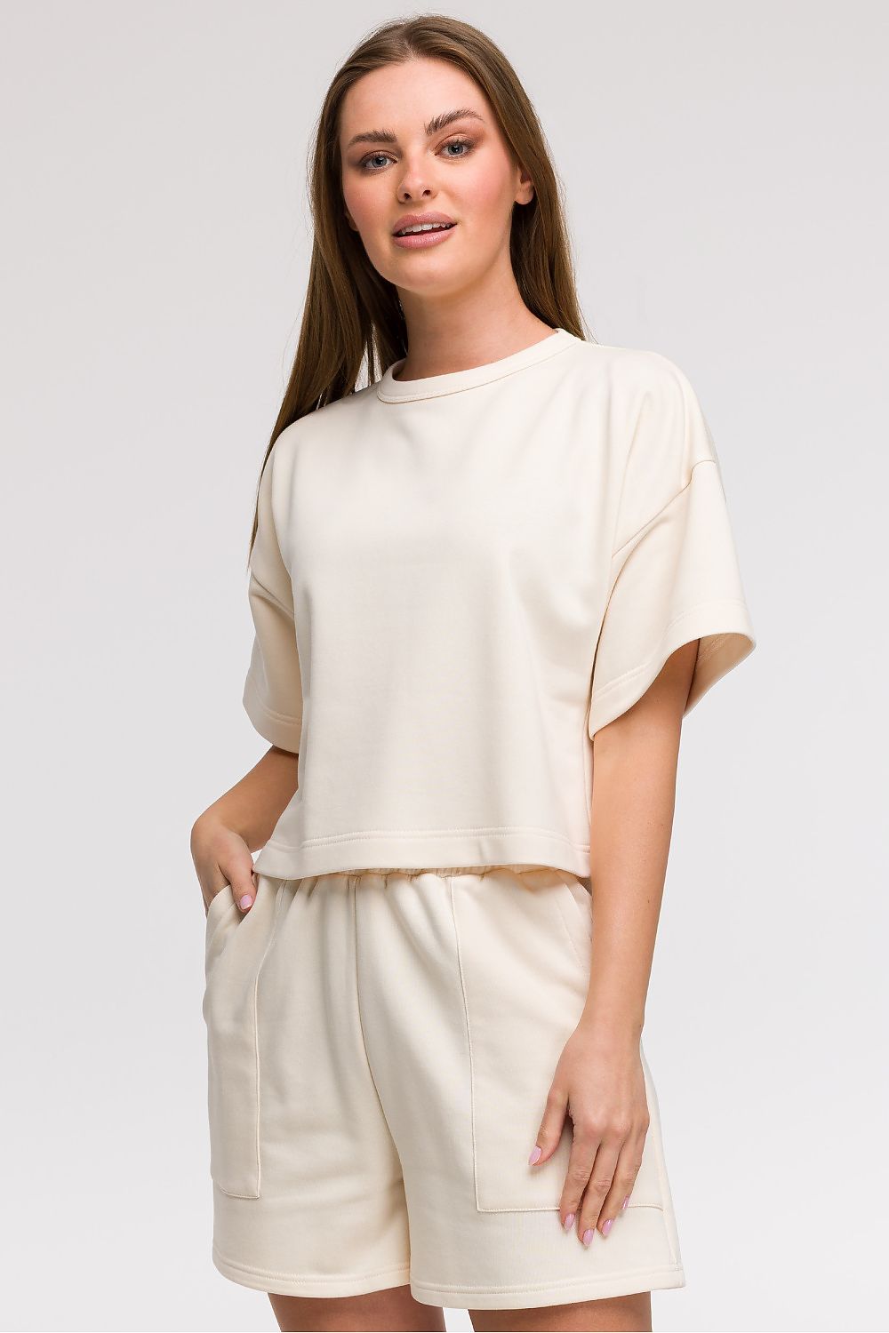 Stylish BeWear women's cropped blouse with wide short sleeves, crafted from a soft cotton-polyester blend, ideal for pairing with shorts and skirts for a chic summer look.