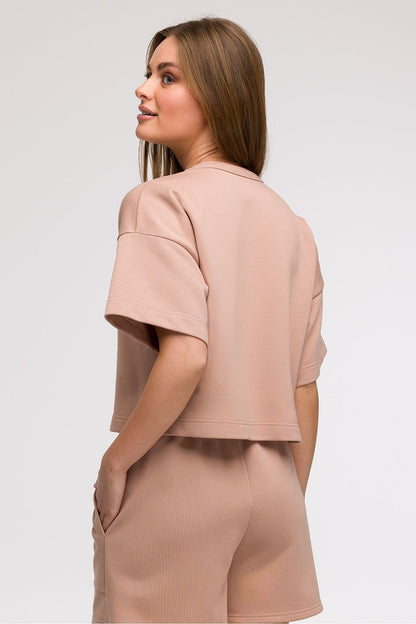 Elegant display of BeWear Women's Cropped Blouse showcasing its minimalist design with a classic round neckline, perfect for pairing with high-waisted fashion.