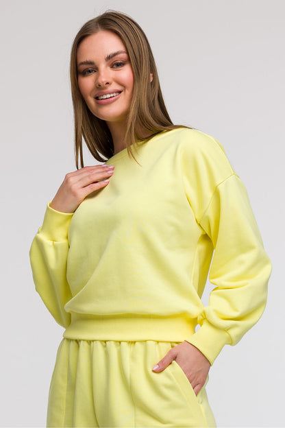 Luxurious oversized sweatshirt blouse by BeWear, crafted in Poland, featuring long sleeves and flattering waist adjustment.