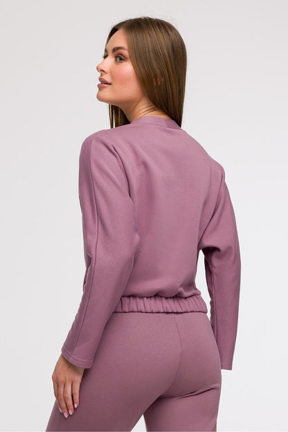 Model wearing the Elegant V-Wrap Blouse by BeWear, exuding style and grace with its flattering V-neck and relaxed fit, suitable for both casual and formal occasions.