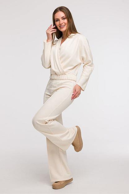 Elegant Women's V-Wrap Blouse by BeWear in soft cotton blend, showcasing luxurious drape and a flattering silhouette.