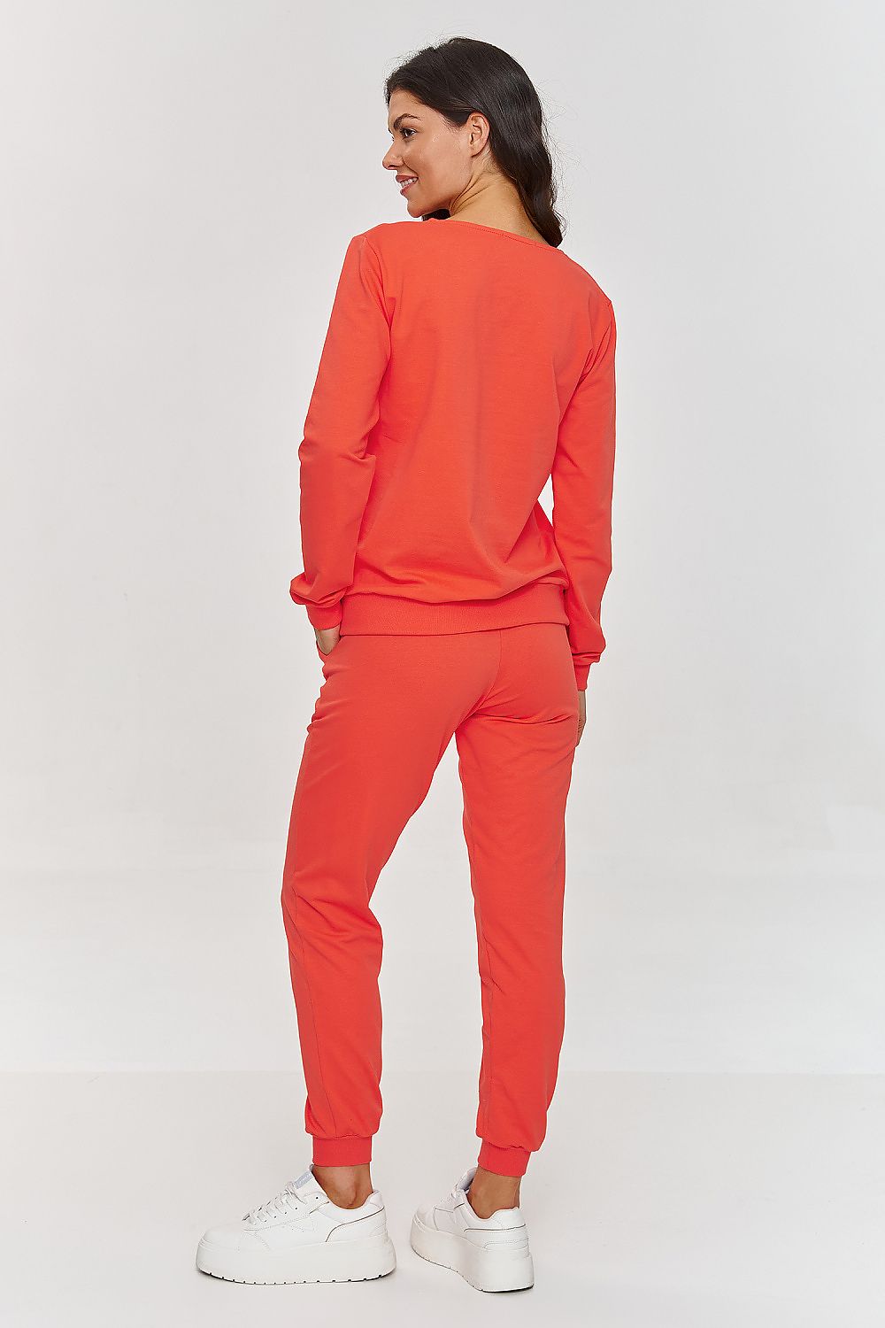 Elegant Women's Tracksuit Set by Makadamia featuring a stylish V-neck hoodie and comfortable pants, ideal for chic outfits.