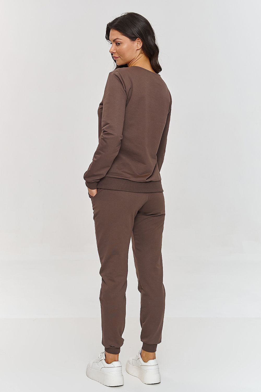 Detail of the side slip pockets and ribbing on the Makadamia Women's Tracksuit Pants, highlighting functionality and style.