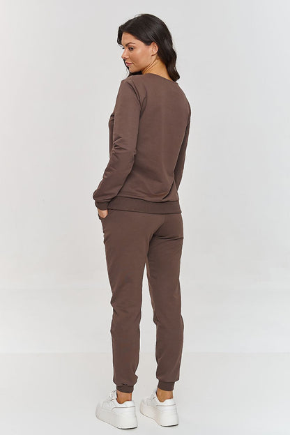 Detail of the side slip pockets and ribbing on the Makadamia Women's Tracksuit Pants, highlighting functionality and style.