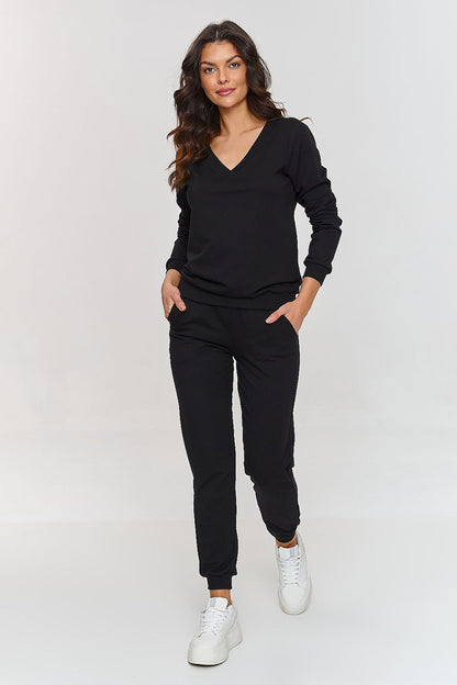 Elegant Women's Tracksuit Set by Makadamia featuring a chic pullover hoodie with ribbed V-neckline and classic pants, perfect for sophisticated outfits.