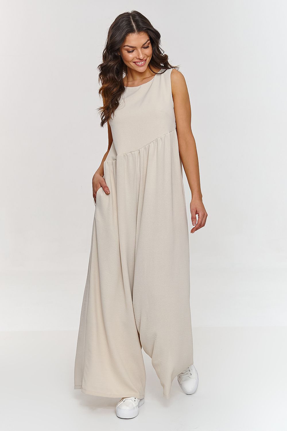 Luxurious Makadamia Women's Maxi Jumpsuit featuring a loose cut and wide legs, perfect for elegant summer outings.