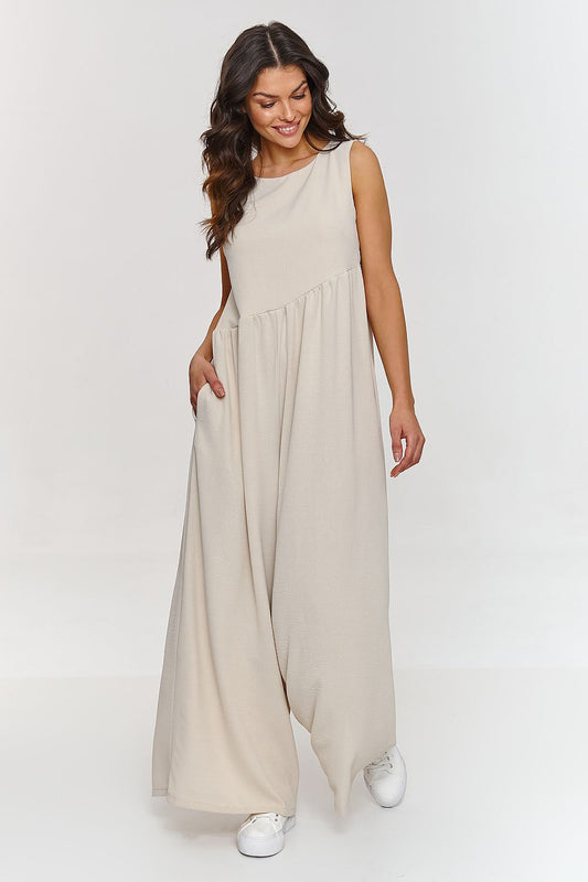 Luxurious Makadamia Women's Maxi Jumpsuit featuring a loose cut and wide legs, perfect for elegant summer outings.