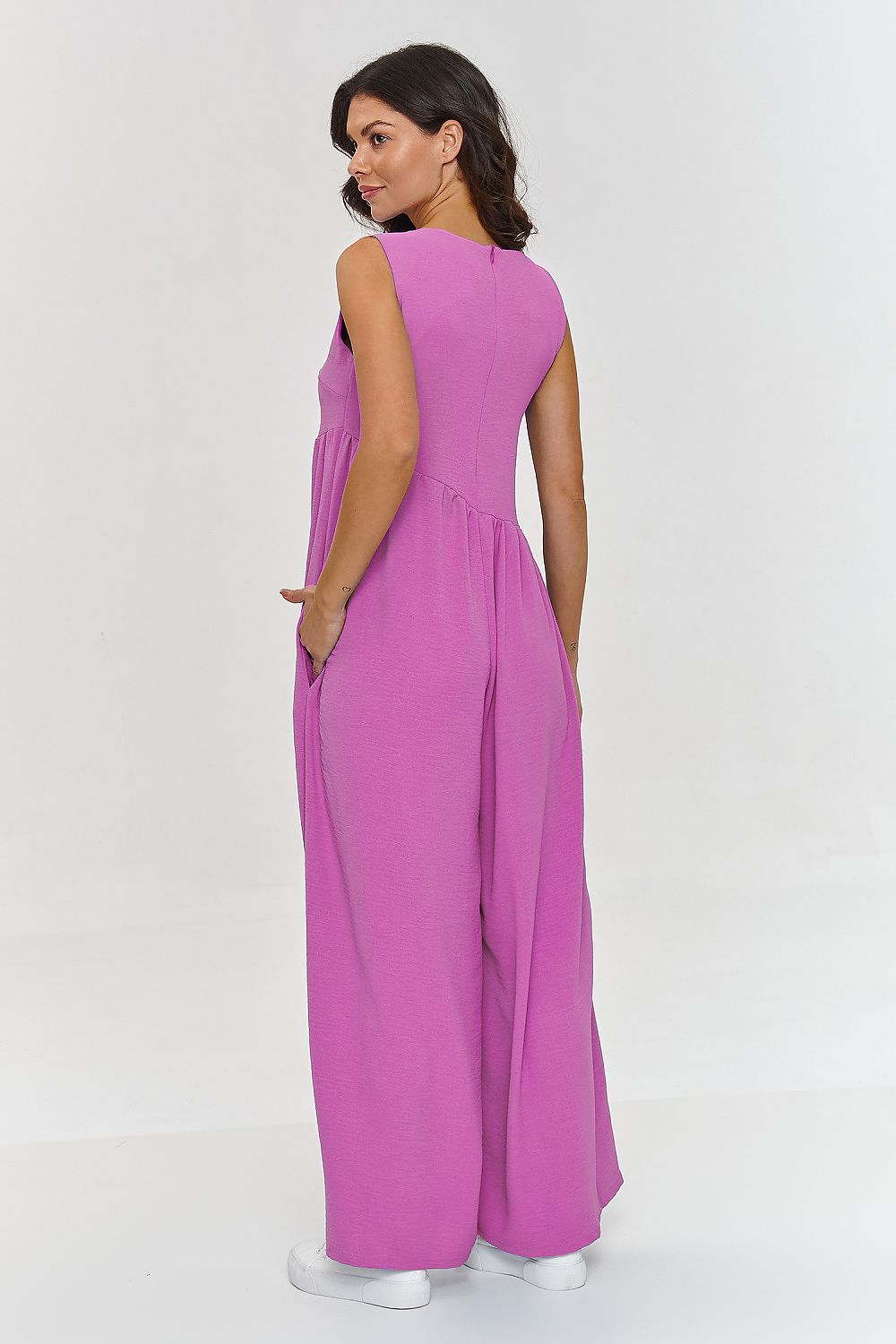 Sophisticated Makadamia jumpsuit with a round neckline and delicate folds, showcasing fashionable style and comfort for EU sizes 36-42.