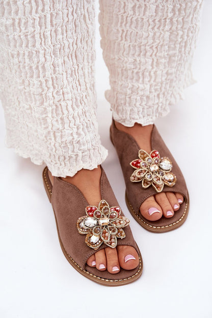 Elegant women's eco suede sandals by Step in Style, featuring a delicate flower detail and adjustable buckle.