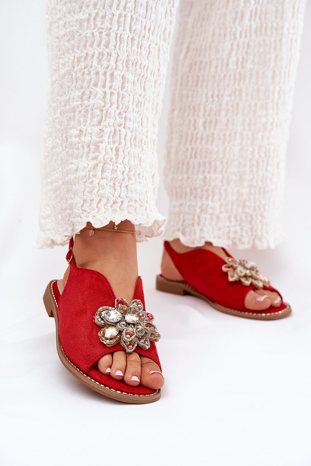 Luxurious eco suede sandals for women from Step in Style, showcasing a stylish flower accent and a comfortable flat heel.