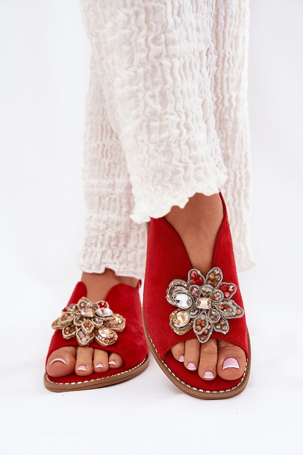 Step in Style women's sandals in eco suede, adorned with intricate flower details and designed for all-day comfort.