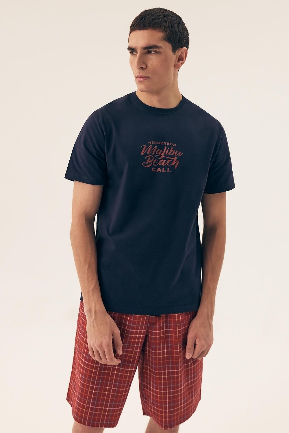 Luxurious Henderson Men's Cotton Pyjama Set featuring a stylish loose-fit top and plaid shorts, ideal for comfortable sleepwear and home lounging.
