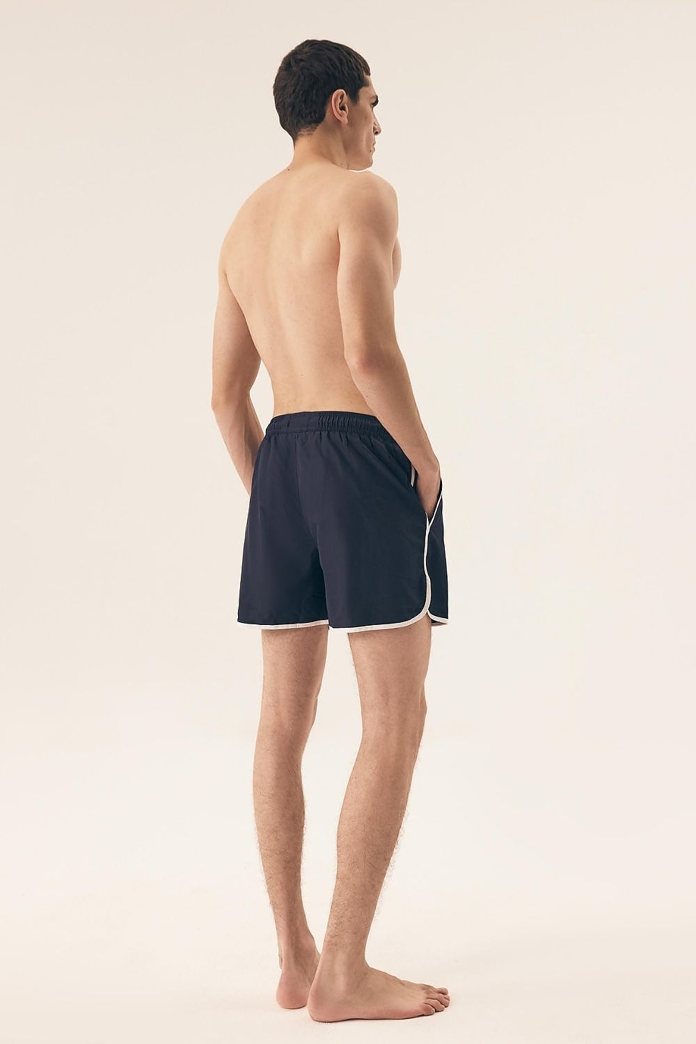 Close-up of Henderson's Men's Swim Trunks showcasing fine stitching and practical side pockets, epitomising comfort and style for discerning summer vacationers.