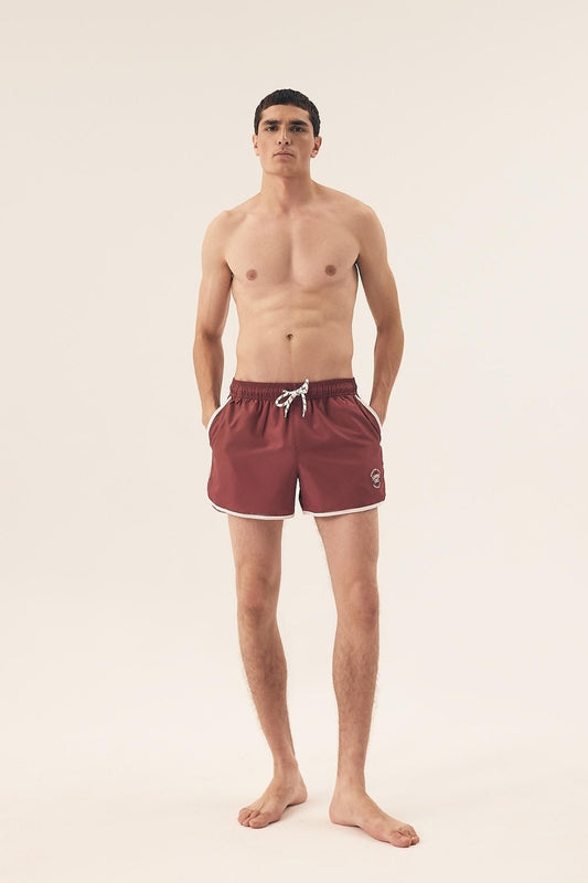 Close-up of Henderson Men's Swim Trunks showcasing adjustable waist and side pockets for added functionality and style.