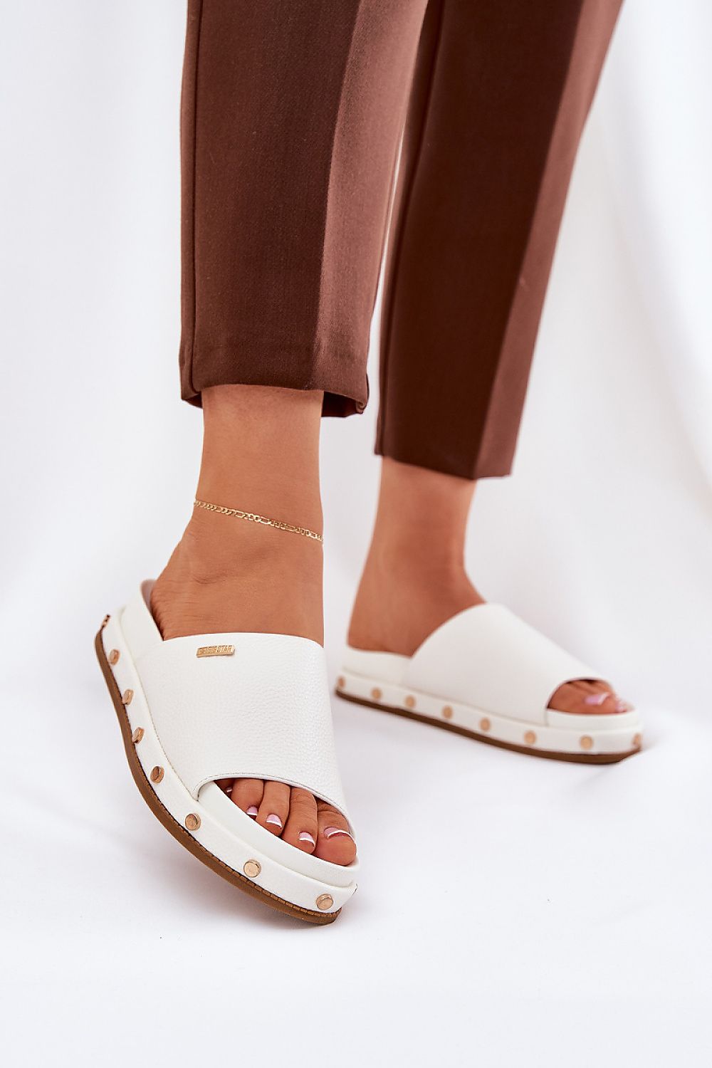 Elegant Big Star women's flip-flops crafted from eco-leather with bold studs and a 4 cm platform for added comfort, designed for luxurious summer fashion by Step in style.