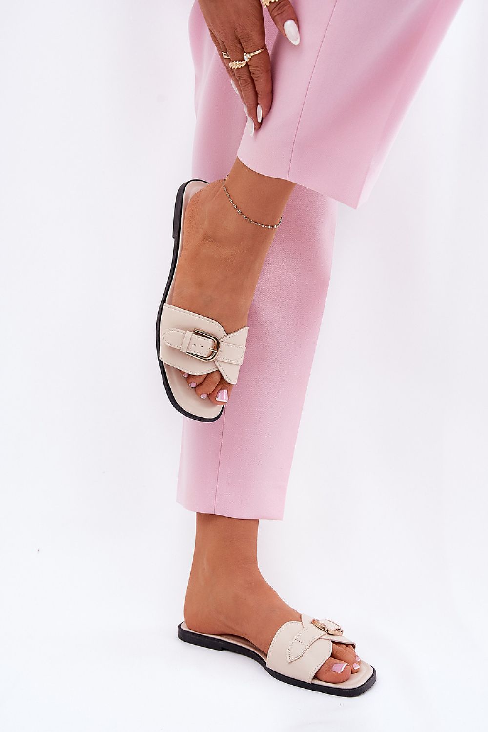 Step in Style's luxury eco leather flip-flops showcasing a chic gold buckle, designed for comfort and elegance in summer footwear.