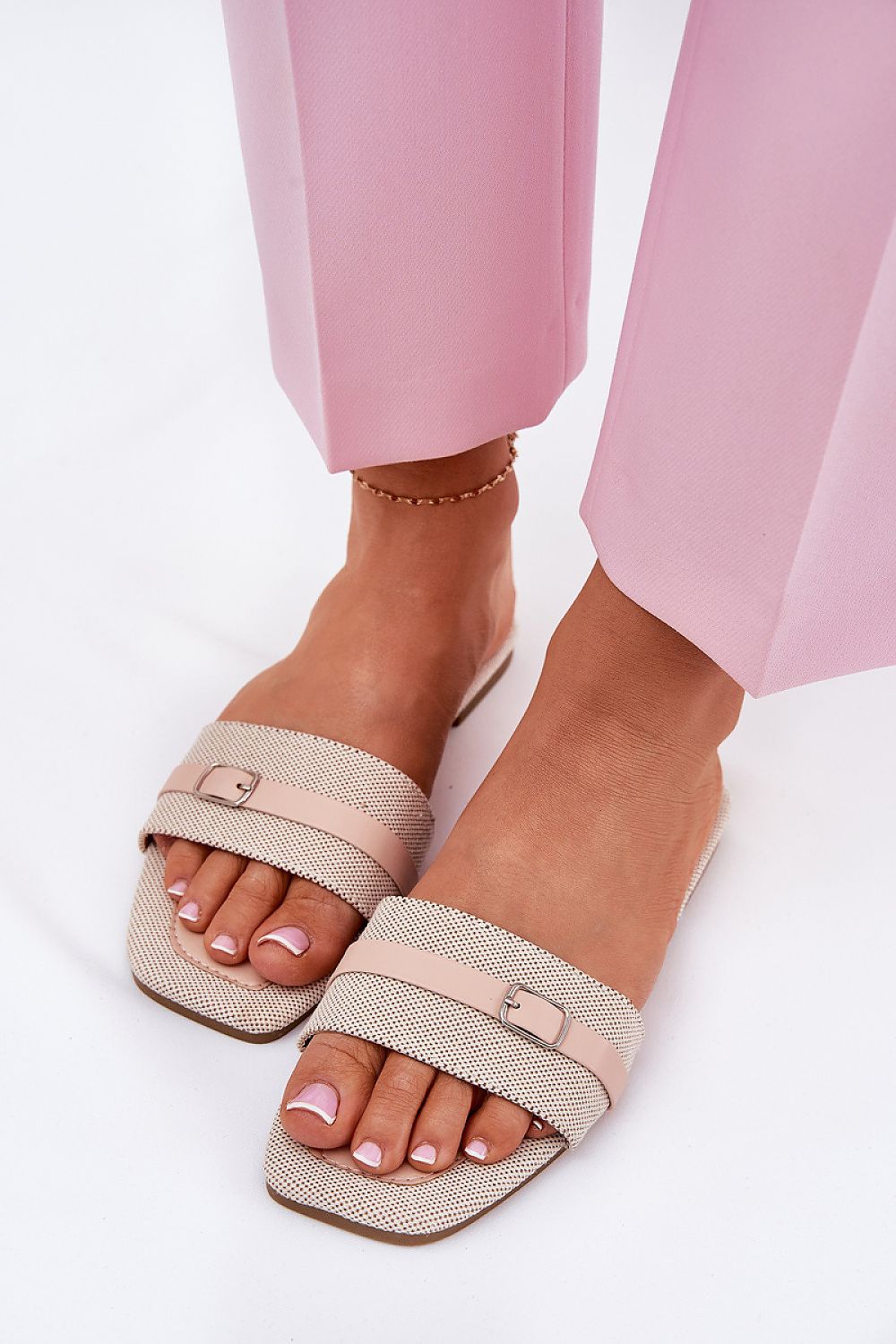 Luxury women's flip-flops from Step in Style featuring a thin strap with buckle, perfect for summer outings.