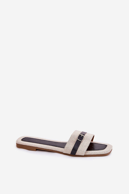 Step in Style luxury women's flip-flops with delicate straps and a sleek buckle, ideal for pairing with light summer attire.