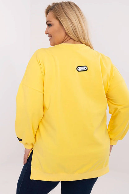 Close-up of the Relevance plus size cotton sweatshirt showcasing the soft fabric blend and chic patch details, perfect for sophisticated casual styling.
