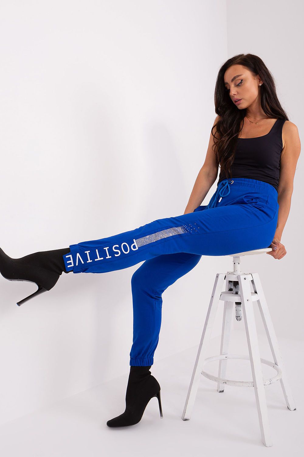 Elegant cotton and spandex blend high-waisted sweatpants from Relevance, designed with sporty elastic cuffs and side pockets for functionality.