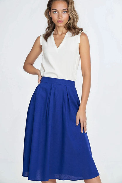 Luxury midi skirt by Nife featuring a stylish linen texture, decorative pleats, and hidden pockets, perfect for elegant summer occasions.