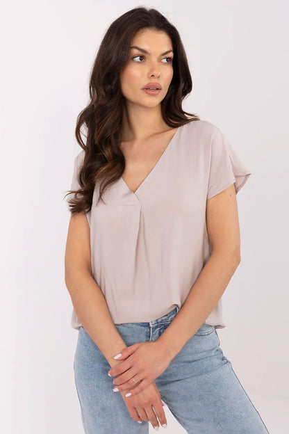 Sublevel casual blouse displayed on hanger, illustrating its elegant cut and breathable viscose fabric.