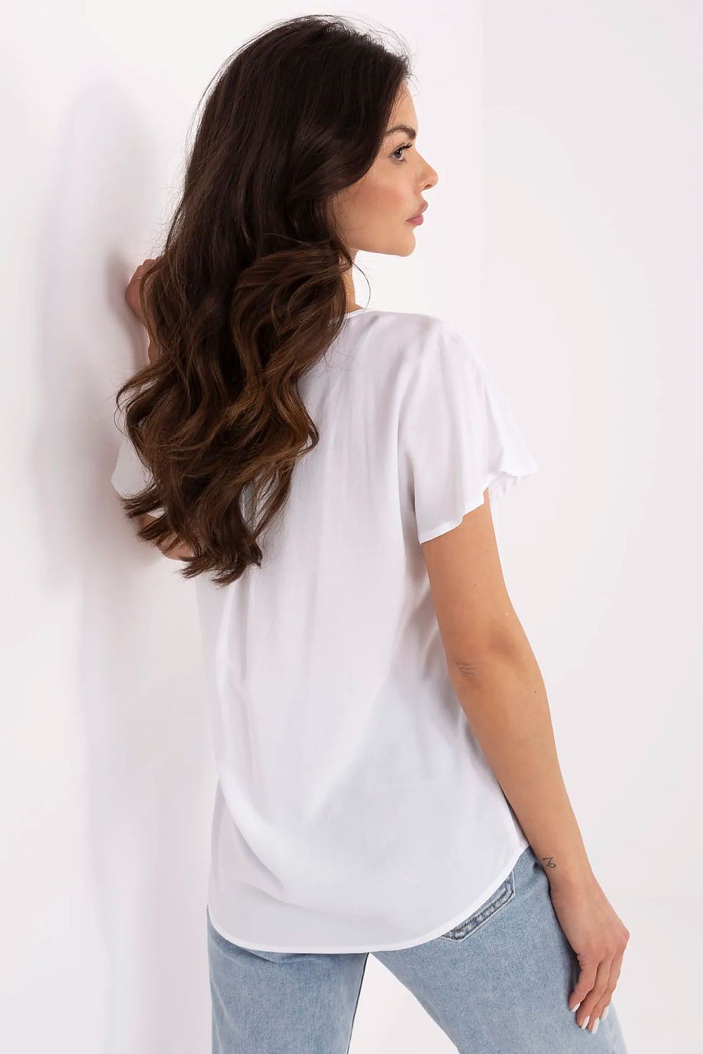 Close-up of Sublevel's elegant blouse detailing, featuring smooth material and a comfortable fit, perfect for a casual yet stylish appearance.