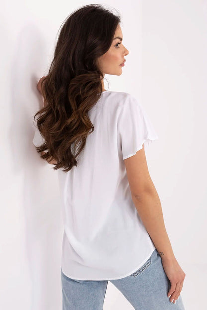 Close-up of Sublevel's elegant blouse detailing, featuring smooth material and a comfortable fit, perfect for a casual yet stylish appearance.