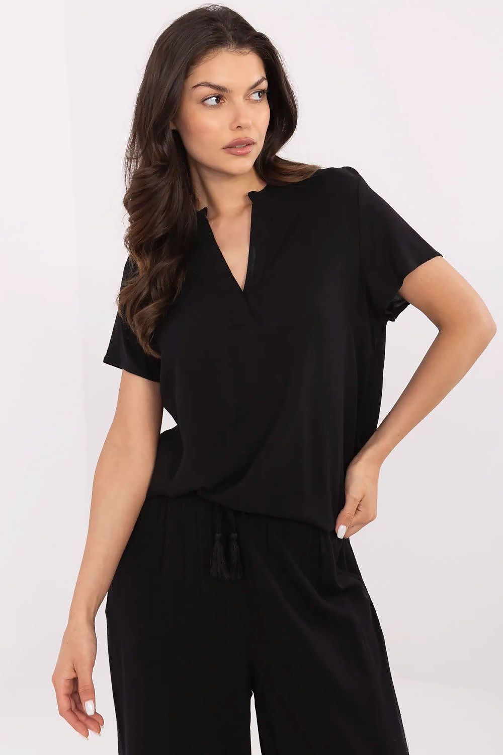 Sublevel's versatile viscose blouse in a chic design, highlighting its lightweight fabric and short sleeves for summer elegance.