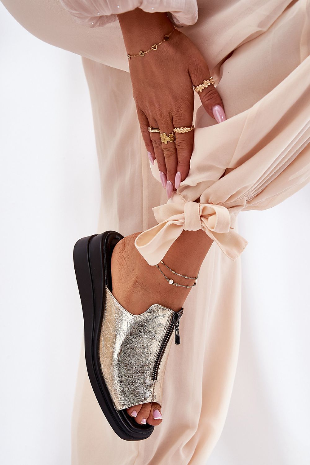 Close-up view of the decorative buckle on Step in Style women's eco leather wedge sandals, combining elegance and modern design.