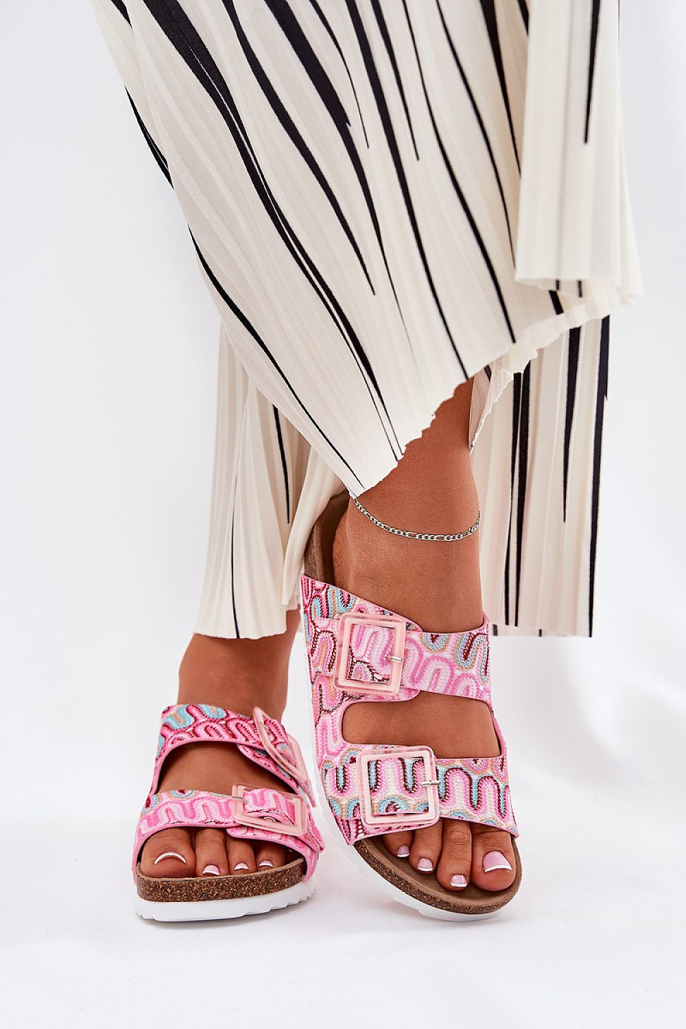 Stylish cork platform flip-flops featuring fashionable patterned straps, perfect for any summer outfit by Step in Style.