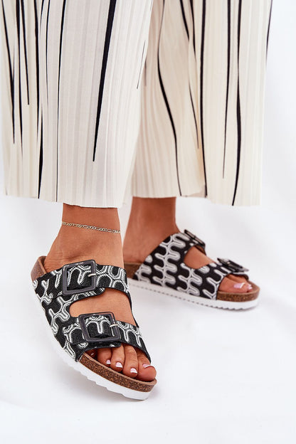 Elegant women's patterned flip-flops from Step in Style, showcasing a cork platform and sequin accent buckles for a luxurious look.
