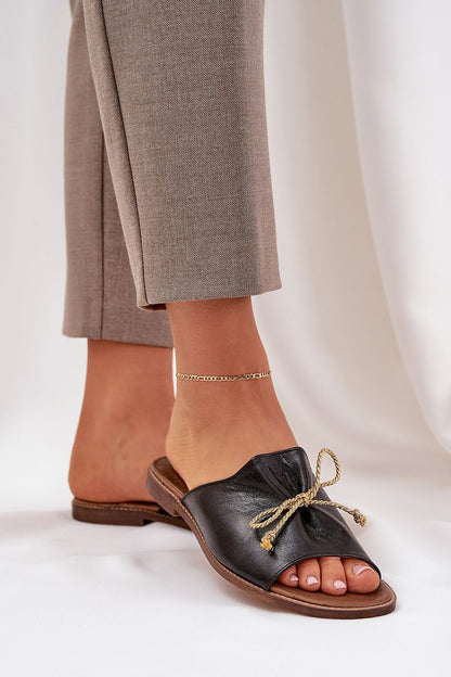 A close-up view of Step in style's elegant leather flat sandals, highlighting the luxurious design and comfort suitable for summer outfits.
