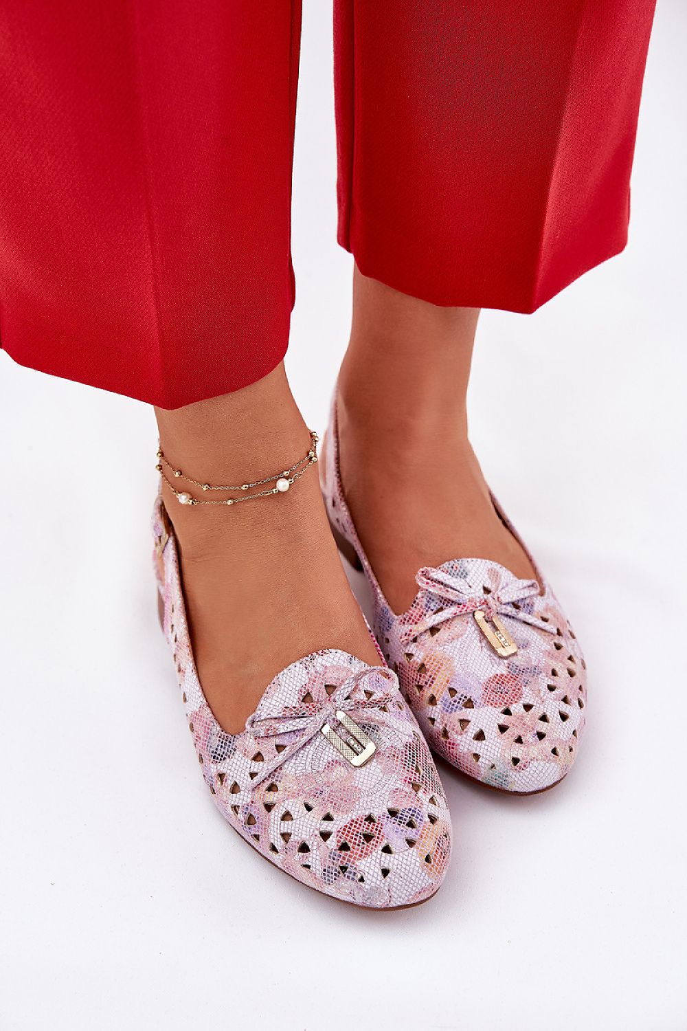Close-up of Jezzi women's eco-suede ballet flats showcasing the soft texture and striking bow, designed for sophisticated style.
