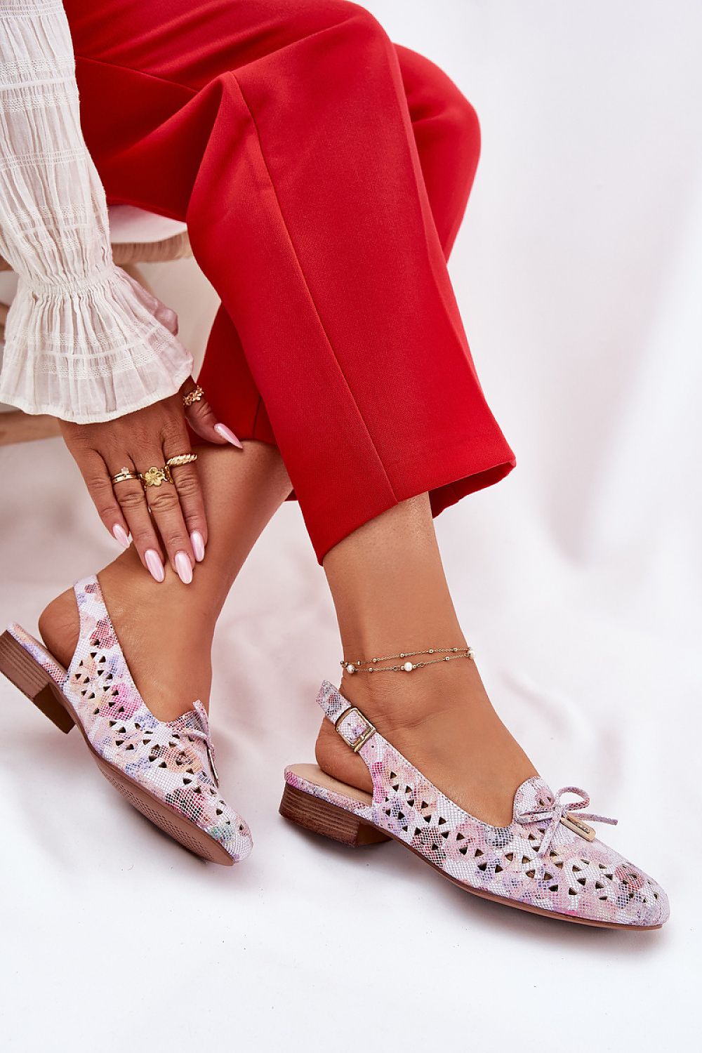 Stylish Jezzi women's ballet flats in eco-suede, highlighting the delicate bow and 2.5cm flat heel for modern elegance.