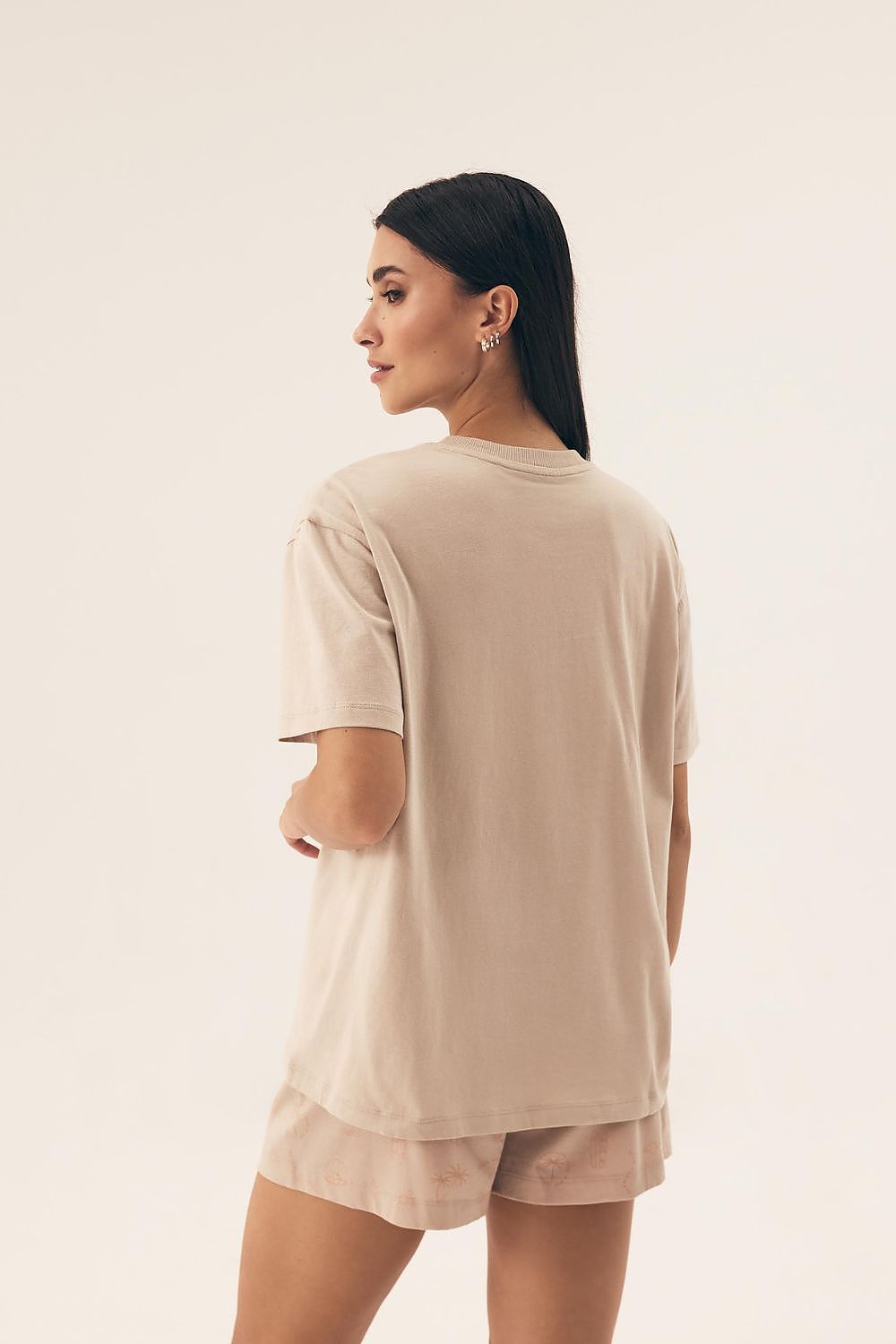 Chic Henderson women's pyjamas outfit, showcasing loose-fitting shorts and a trendy round-neck shirt, ideal for luxurious home wear.