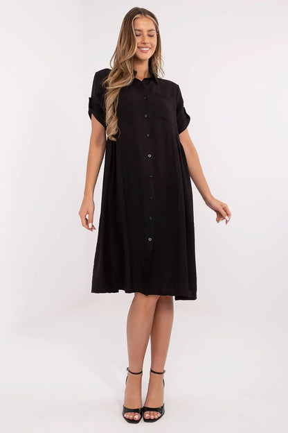 Elegant midi shirt dress by Italy Moda made from a lightweight viscose and nylon blend, featuring a classic collar, decorative pleats, and a chest pocket for a sophisticated yet casual look.