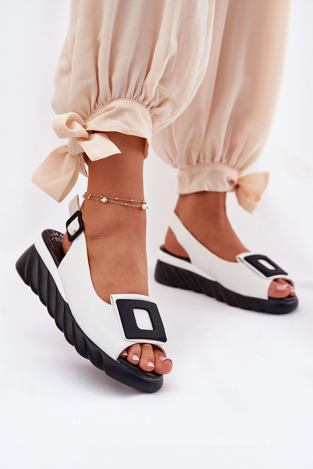 Elegant Women’s Natural Leather Wedge Sandals by Step in Style with Buckle, front view displaying unique leather texture and decorative elements.