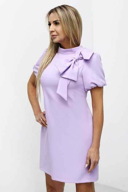 Detailed showcase of Jersa's luxury Barbie pink cocktail dress fabric, showcasing quality and craftsmanship.