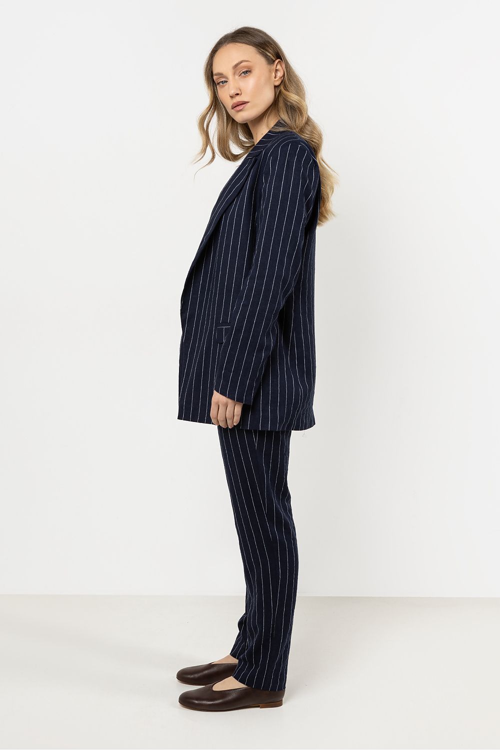 Lightweight linen blazer by Awama featuring delicate stripes, designed for ultimate comfort and style on various occasions.